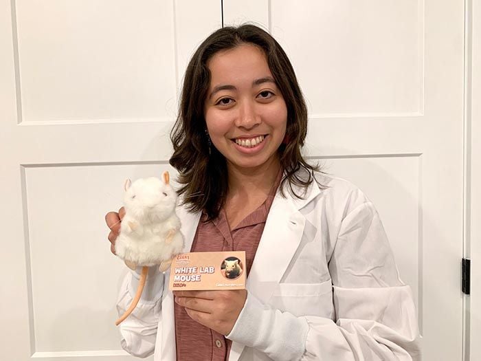 White Lab Mouse with woman in lab coat