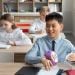 Student holding Dyslexia plush