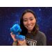 Waterbear plush in space with woman