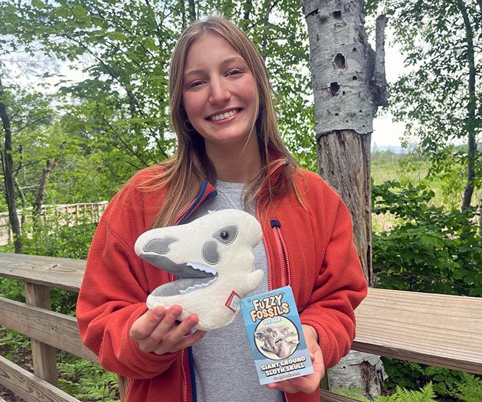 Ground Sloth plush in hand